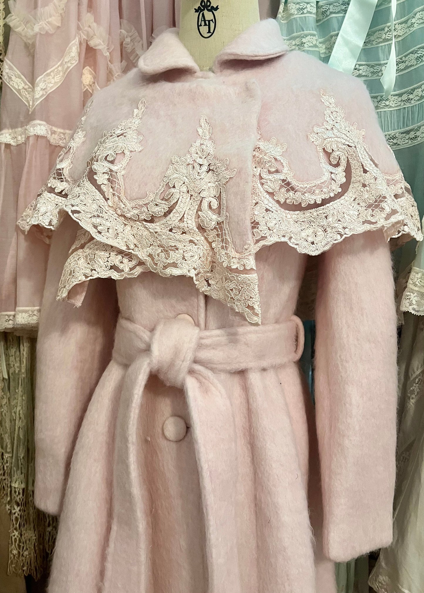 Pink frosting capelet coat